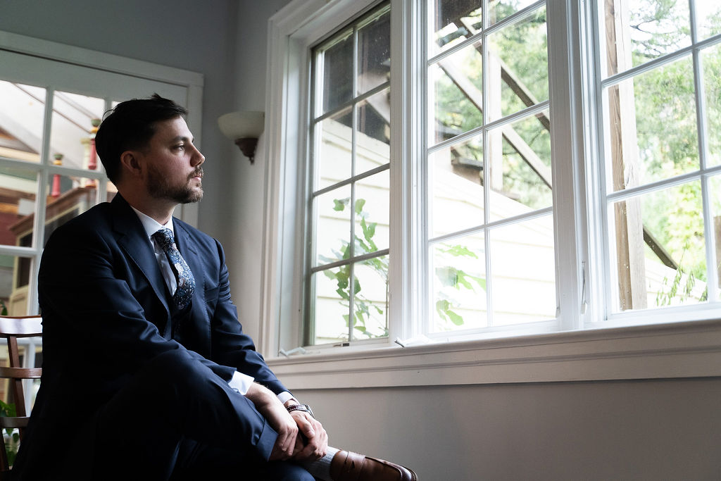 Groom by the window, Anna & Sean